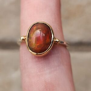 Handmade black opal with gold bezel and sterling silver ring